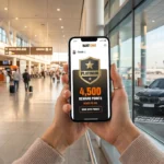 Client utilisant la nouvelle application SIXT ONE pour consulter ses points de location et son statut Platinum.
